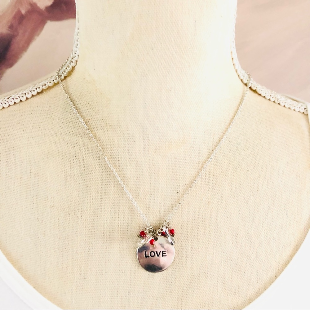 Claire’s “LOVE” disc charm beaded necklace
